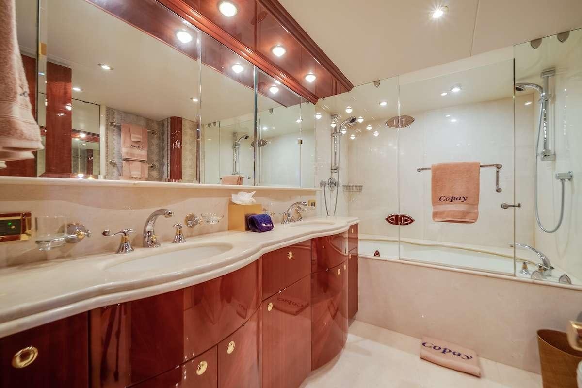 a bathroom with pink counter tops aboard COPAY Yacht for Charter