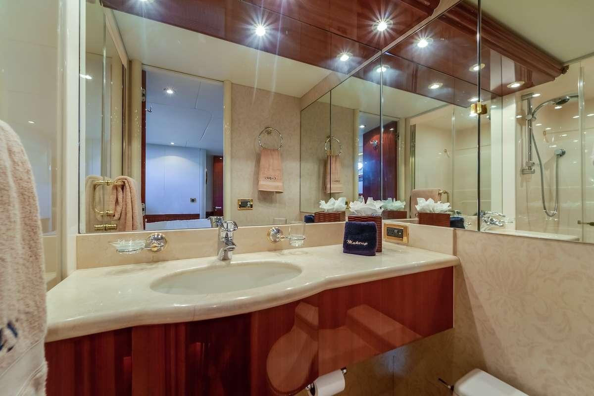 a bathroom with a large mirror aboard COPAY Yacht for Charter