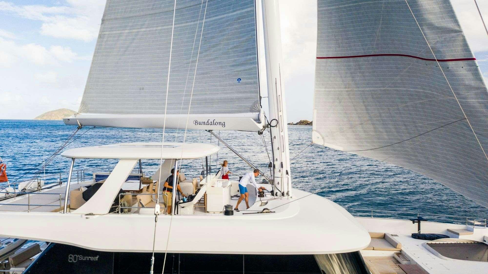 a group of people on a sailboat aboard BUNDALONG Yacht for Charter