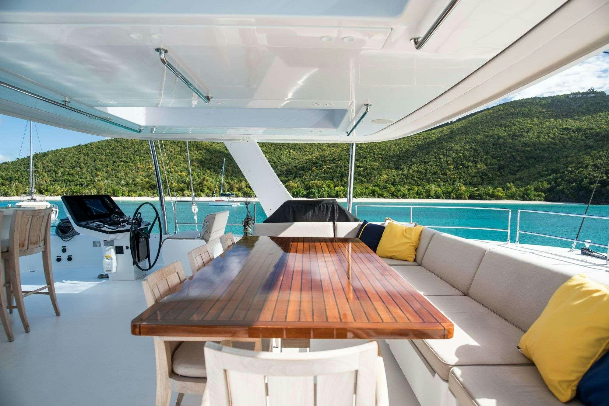 a table on a deck aboard BUNDALONG Yacht for Charter