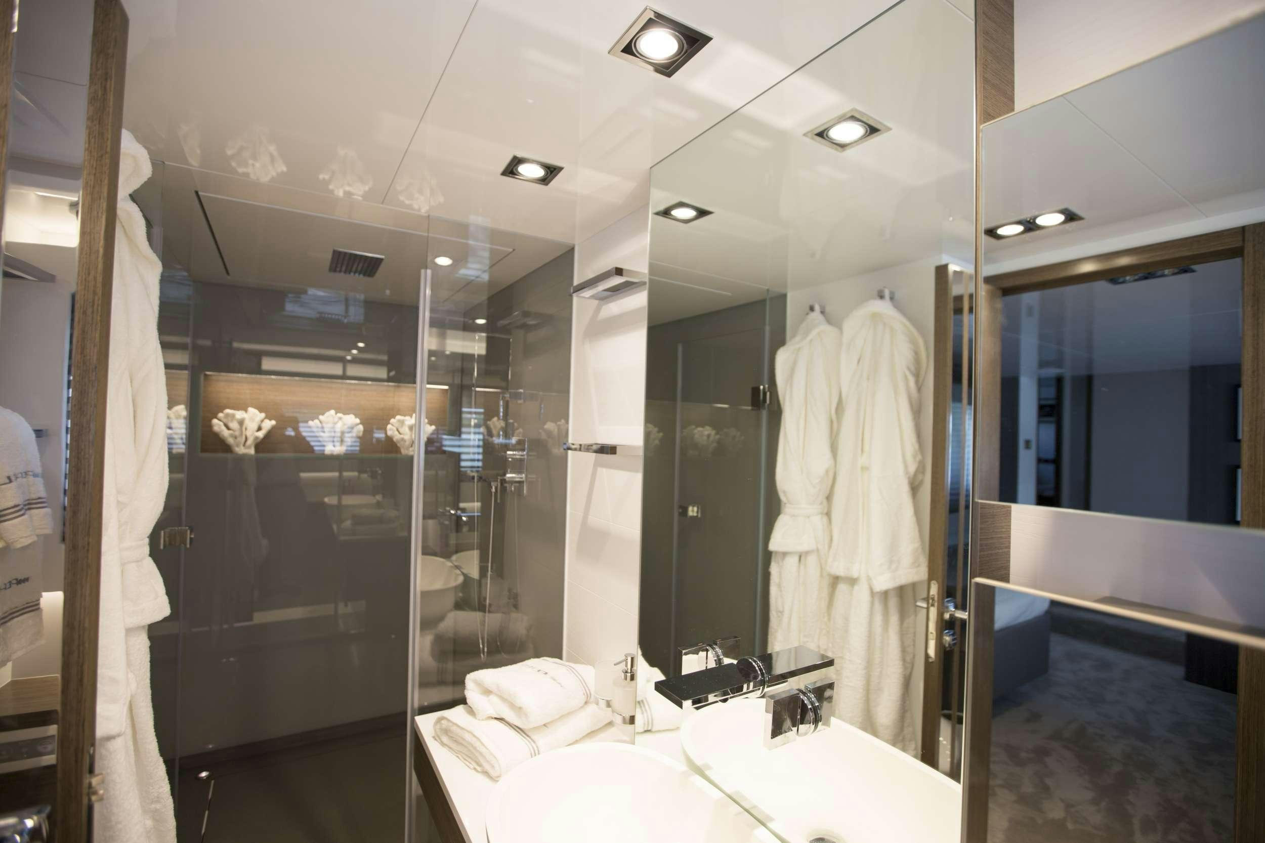 a bathroom with glass walls aboard pearl Yacht for Charter