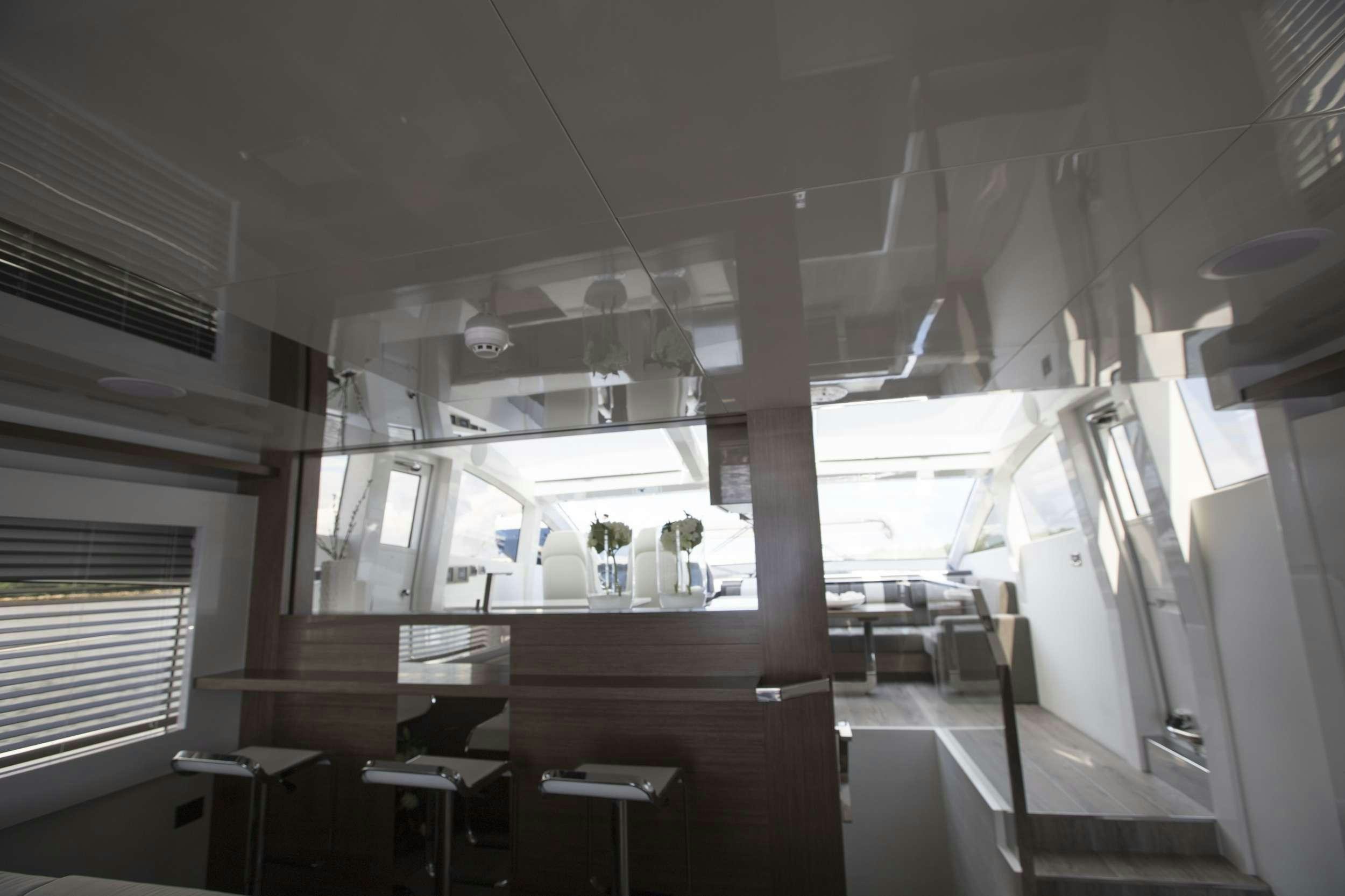 a room with desks and chairs aboard pearl Yacht for Charter