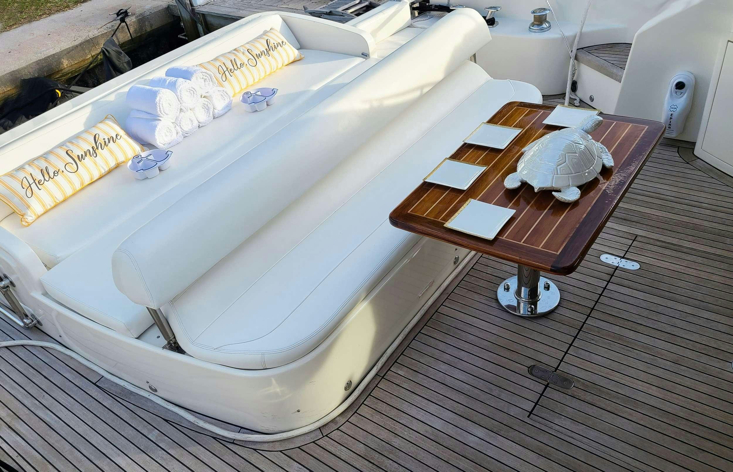 a bathtub with a table and a table aboard SHOWBOAT Yacht for Charter