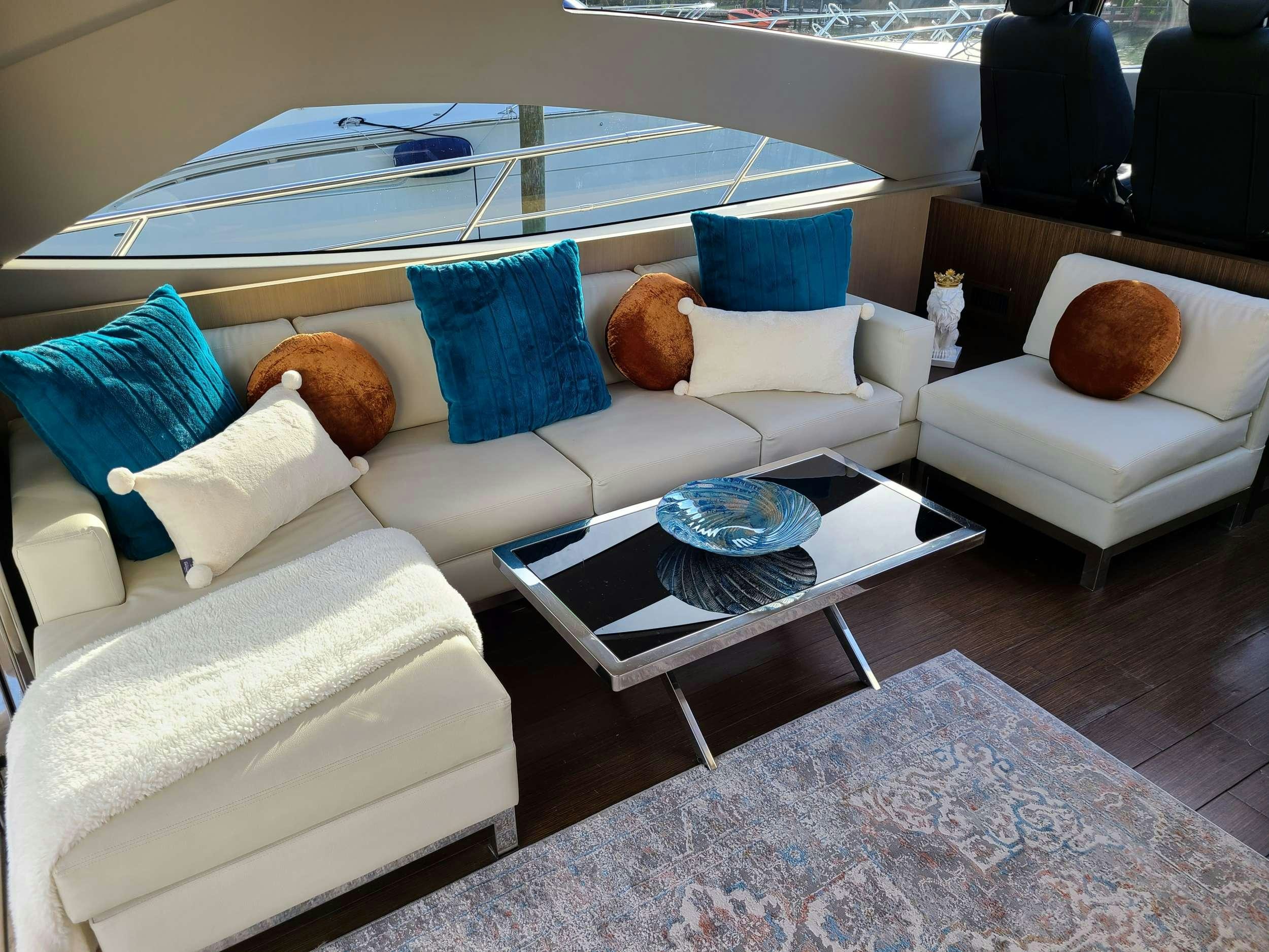 a boat with pillows and a table aboard SHOWBOAT Yacht for Charter