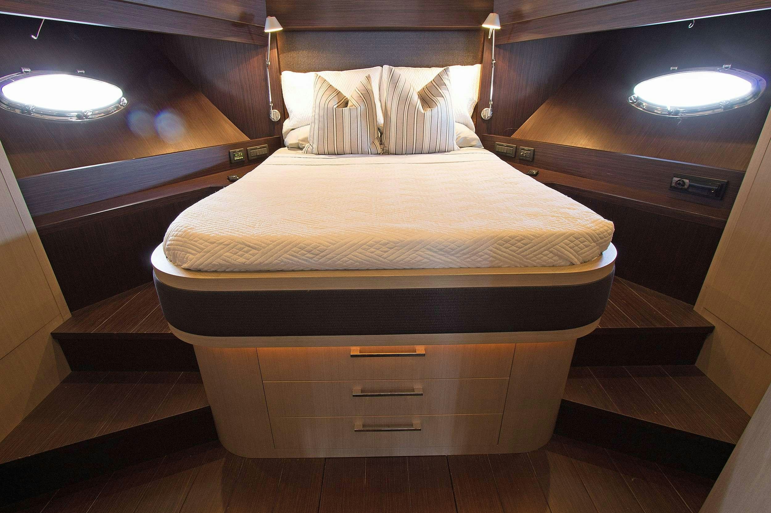 a bed with a cover aboard SHOWBOAT Yacht for Charter