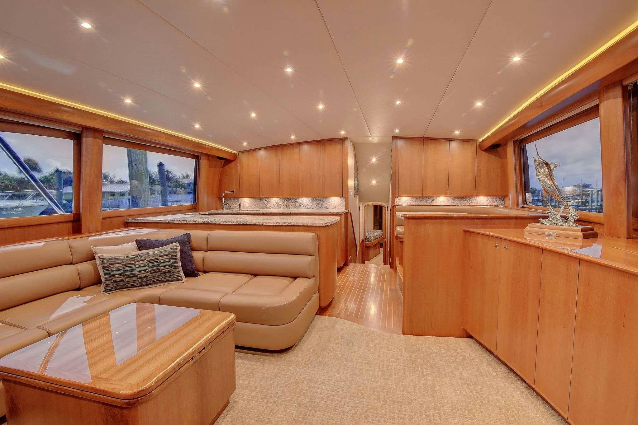 a living room with a couch and a fireplace aboard SINGULARIS Yacht for Charter