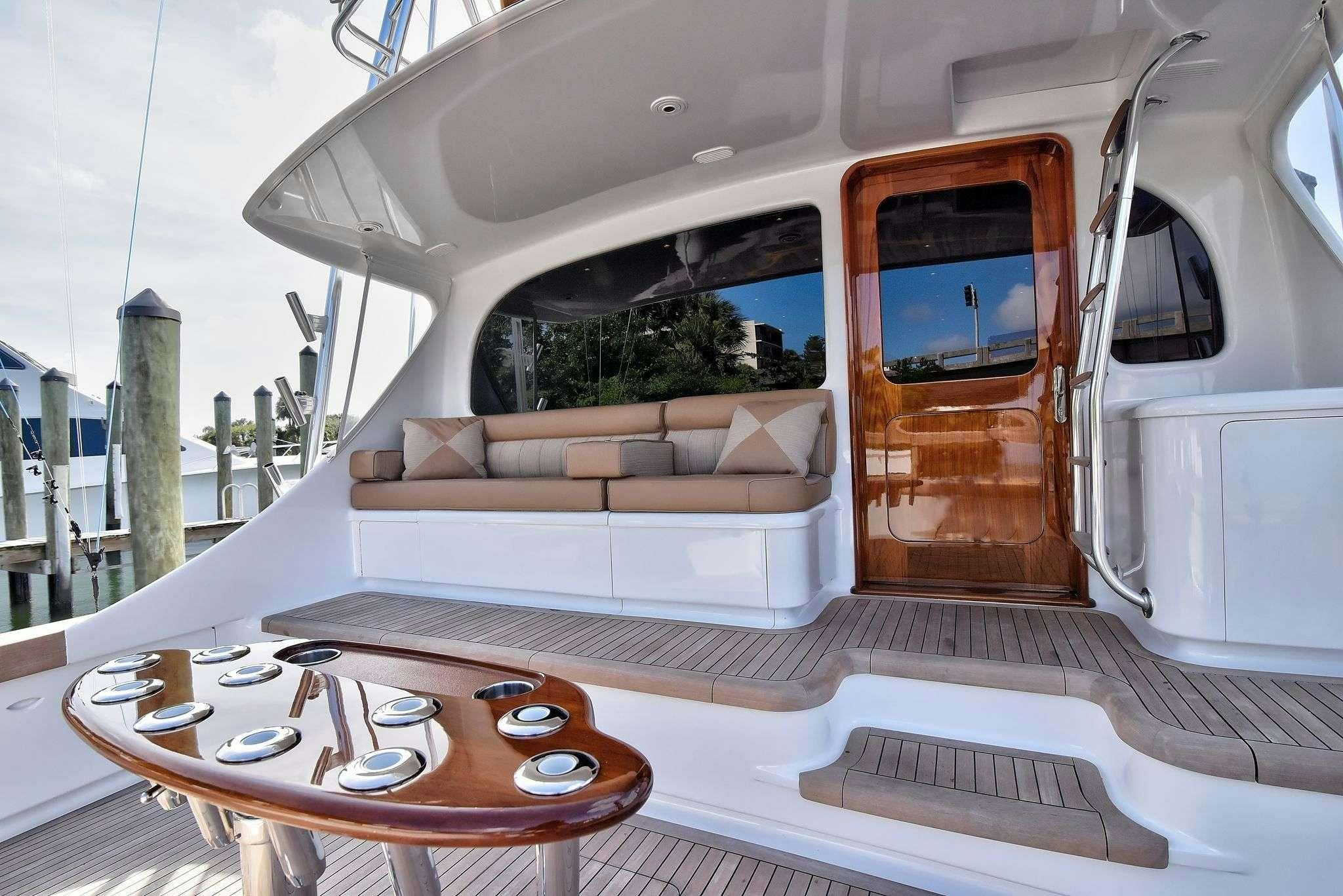 a room with a couch and a table aboard SINGULARIS Yacht for Charter