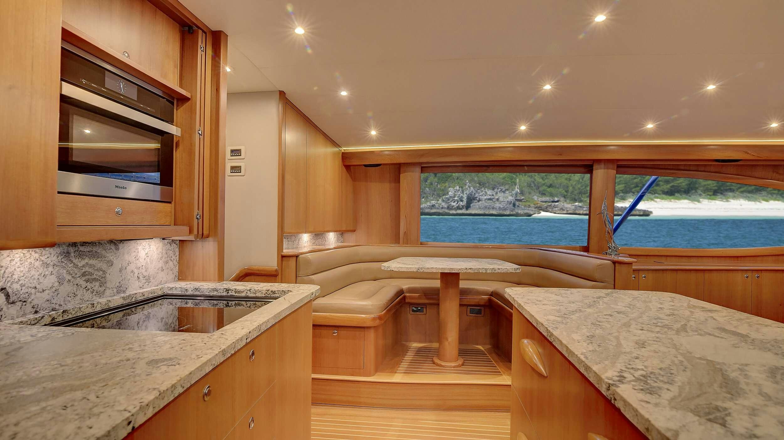 a kitchen with a large window aboard SINGULARIS Yacht for Charter
