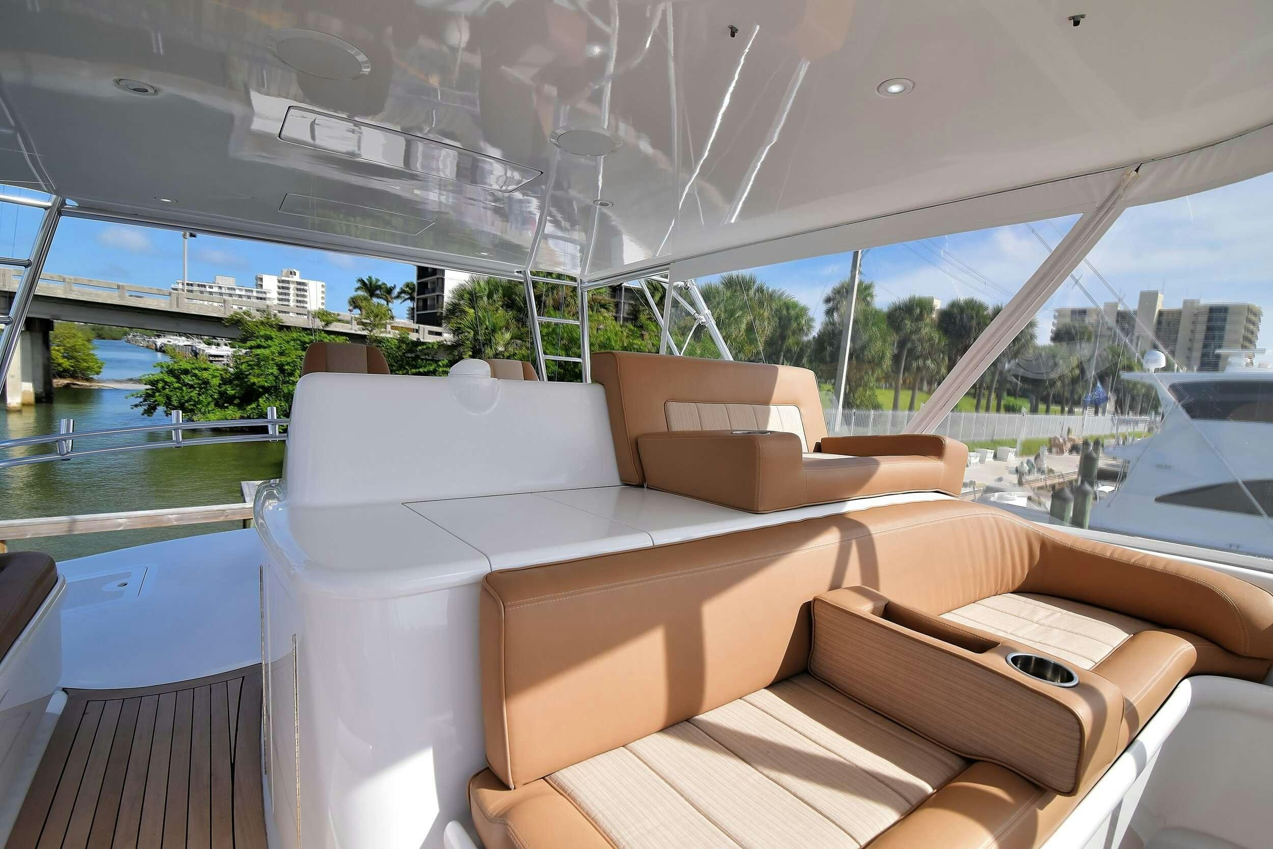a lounge area with couches aboard SINGULARIS Yacht for Charter