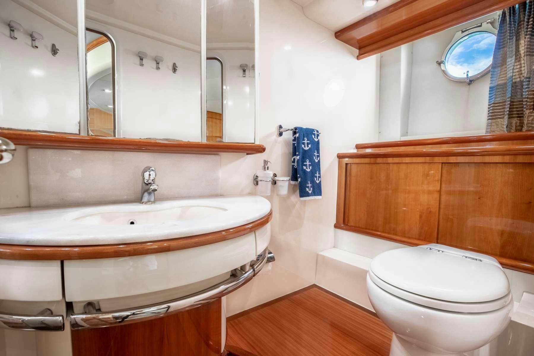 a bathroom with a sink and toilet aboard ALANA ROSE Yacht for Charter