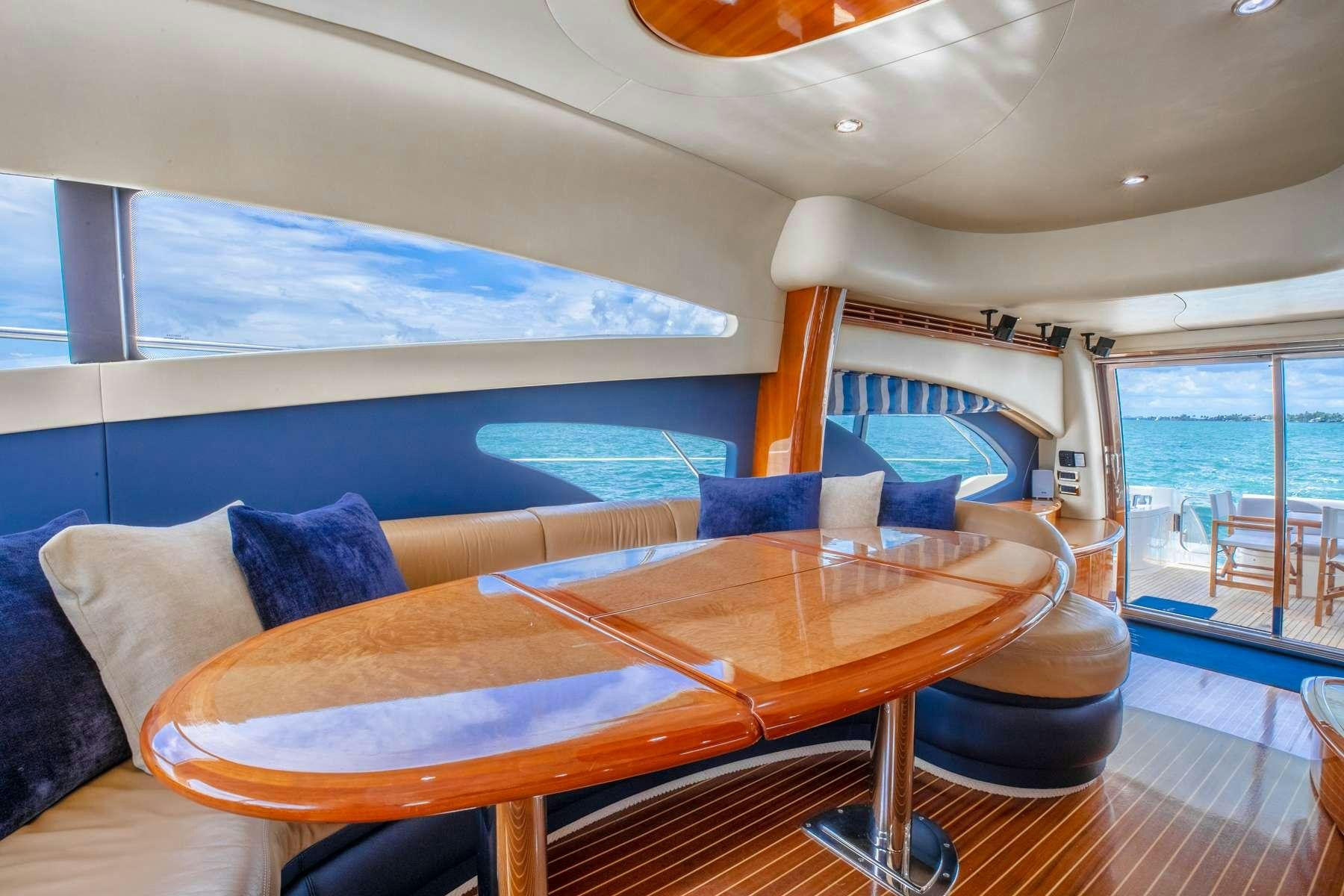 a room with a table and chairs aboard ALANA ROSE Yacht for Charter