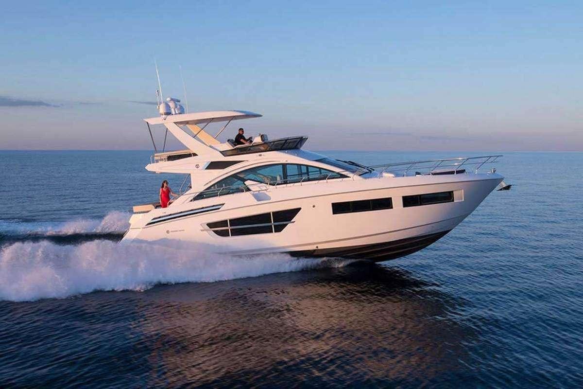 a white yacht on the water aboard RIO Yacht for Charter