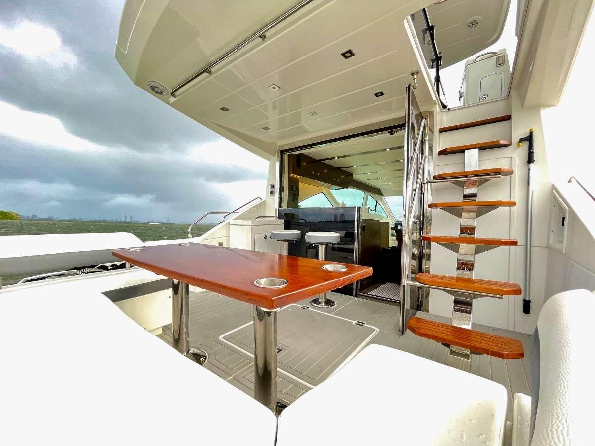 a table with a ladder on it aboard RIO Yacht for Charter