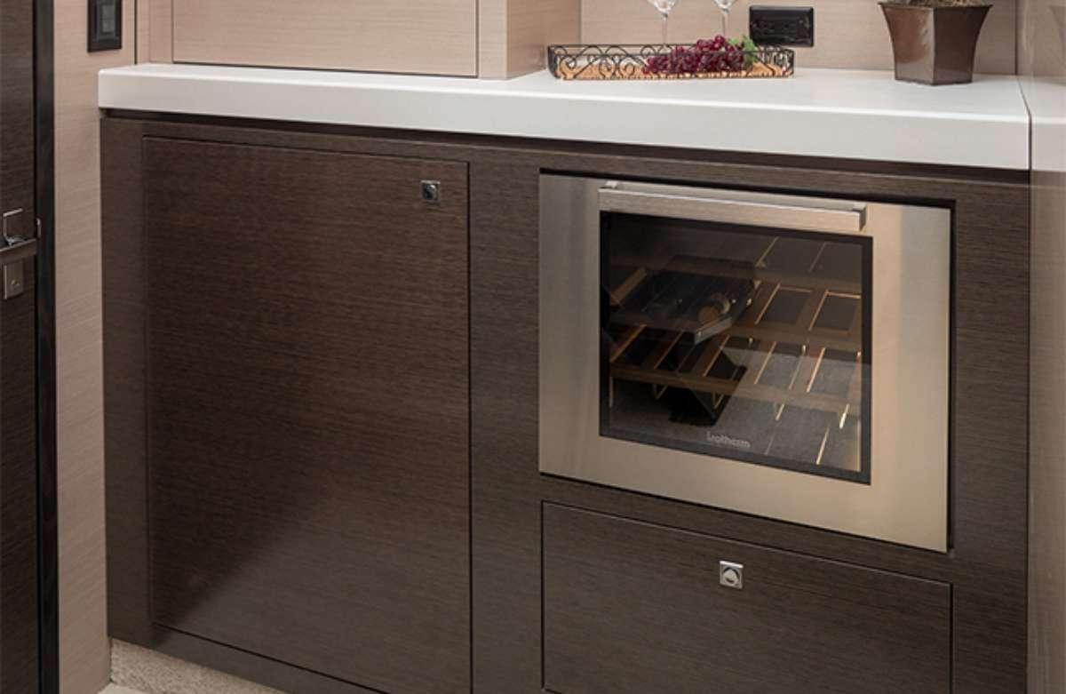 a kitchen with a microwave aboard RIO Yacht for Charter