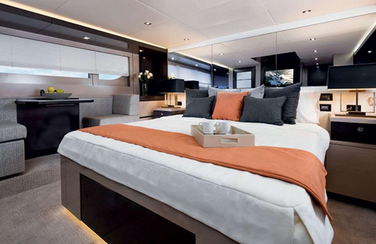 a large bed in a room aboard RIO Yacht for Charter