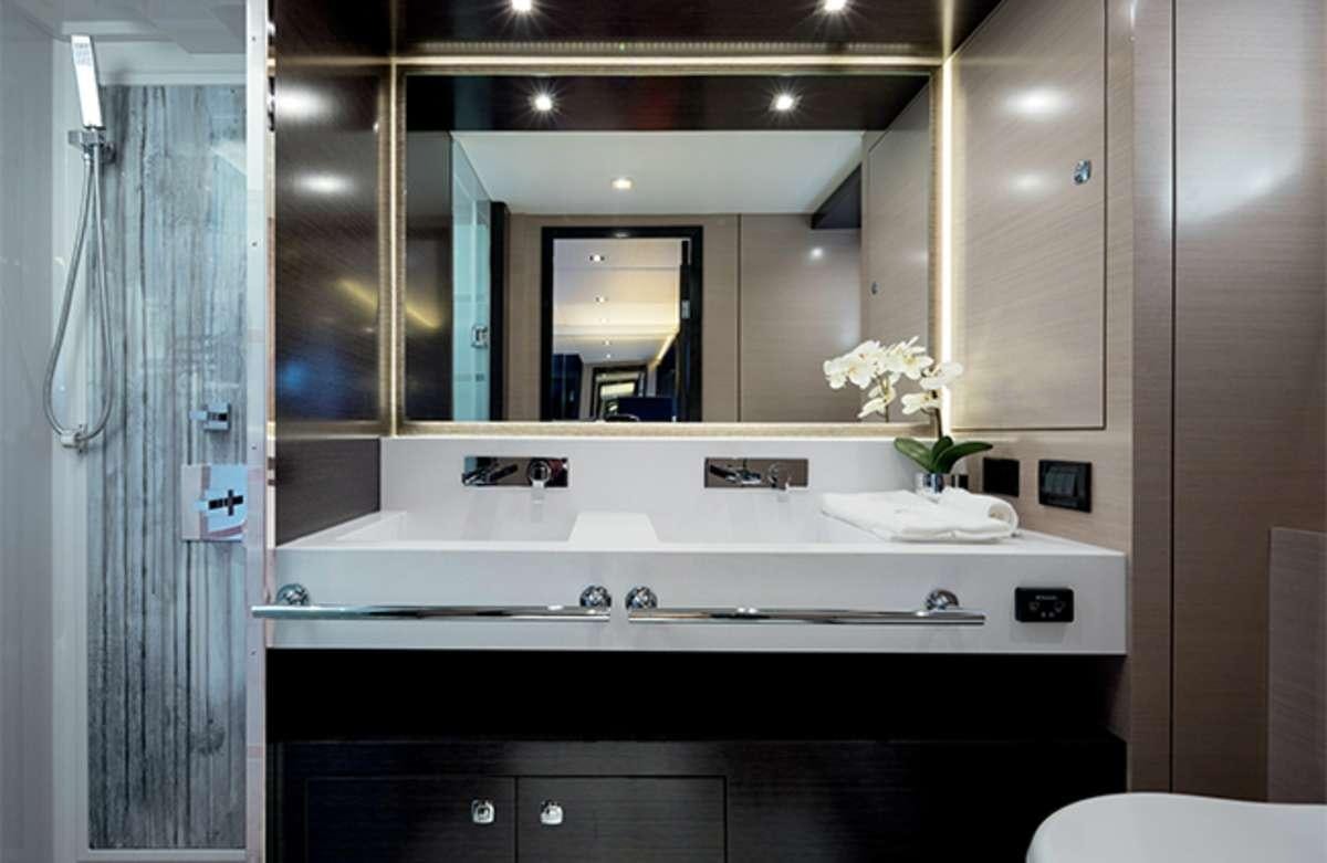 a bathroom with a sink and cabinets aboard RIO Yacht for Charter