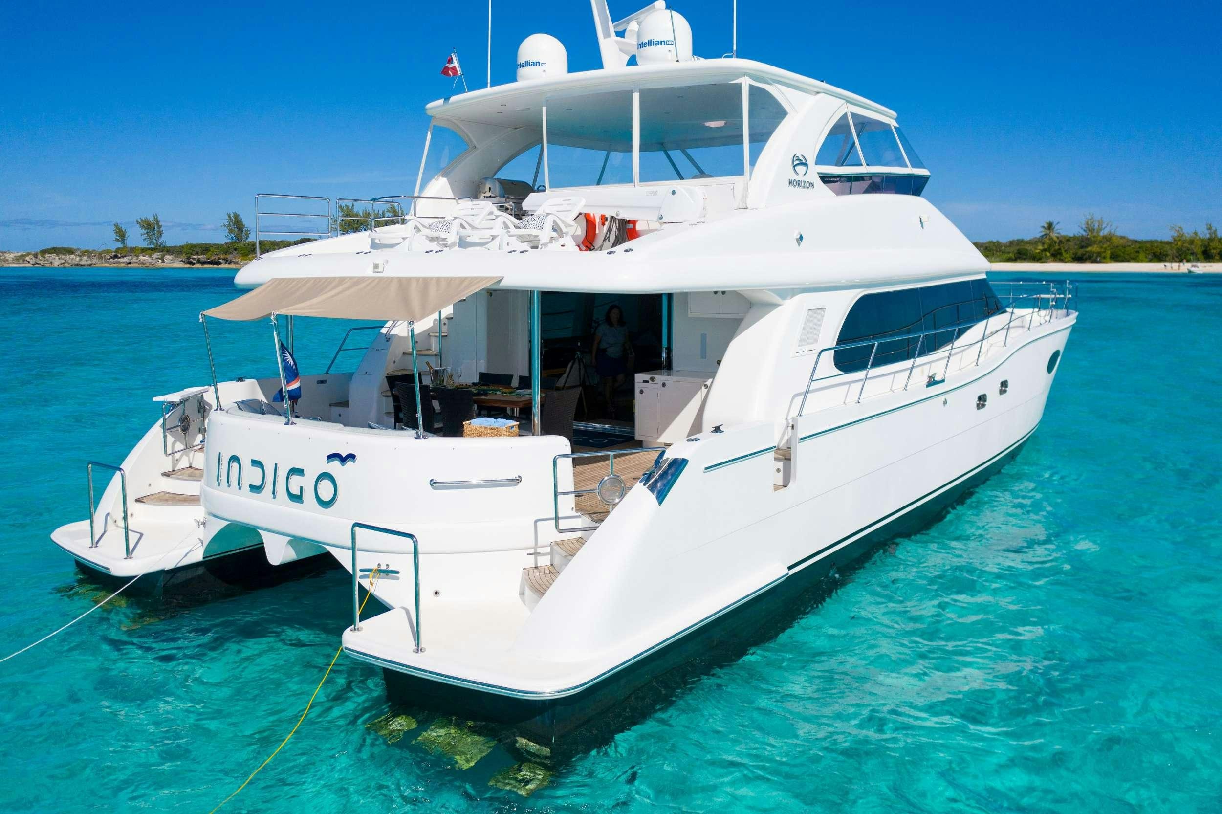 a white boat in the water aboard INDIGO Yacht for Charter
