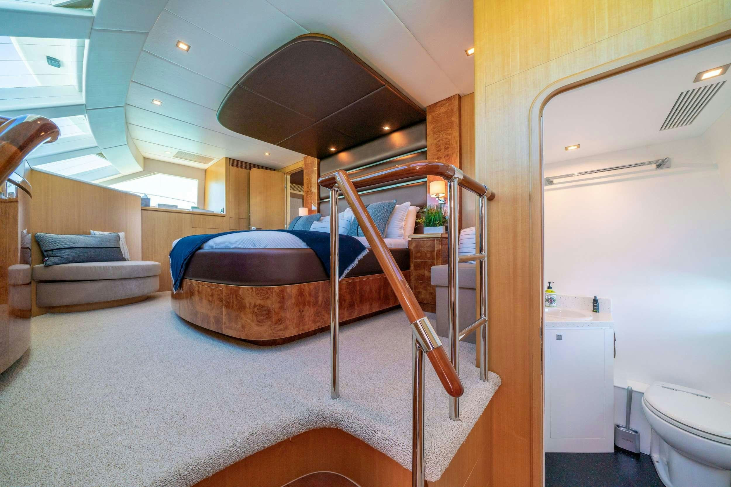 a bed in a room aboard INDIGO Yacht for Charter