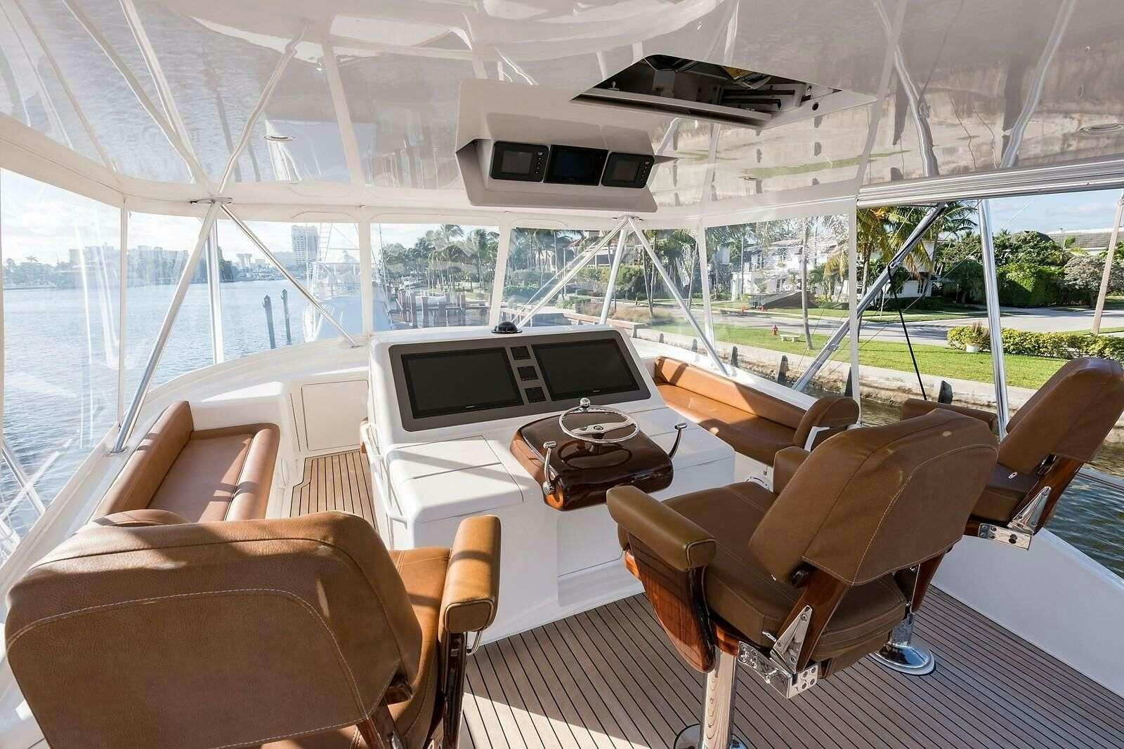 a room with a table and chairs aboard JAYWALKER Yacht for Charter