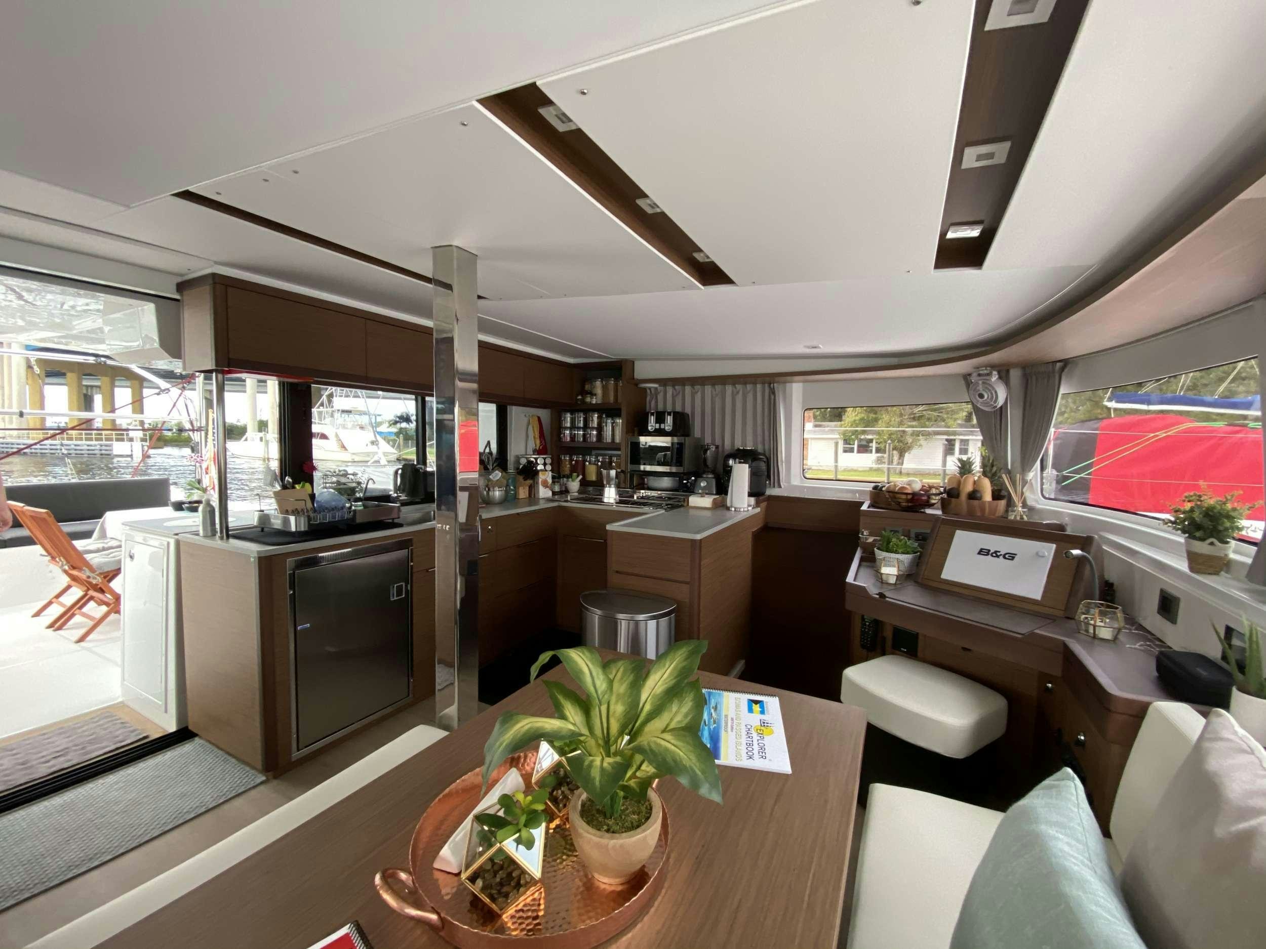 a modern looking kitchen with a large window aboard MARCH DRAGON Yacht for Charter