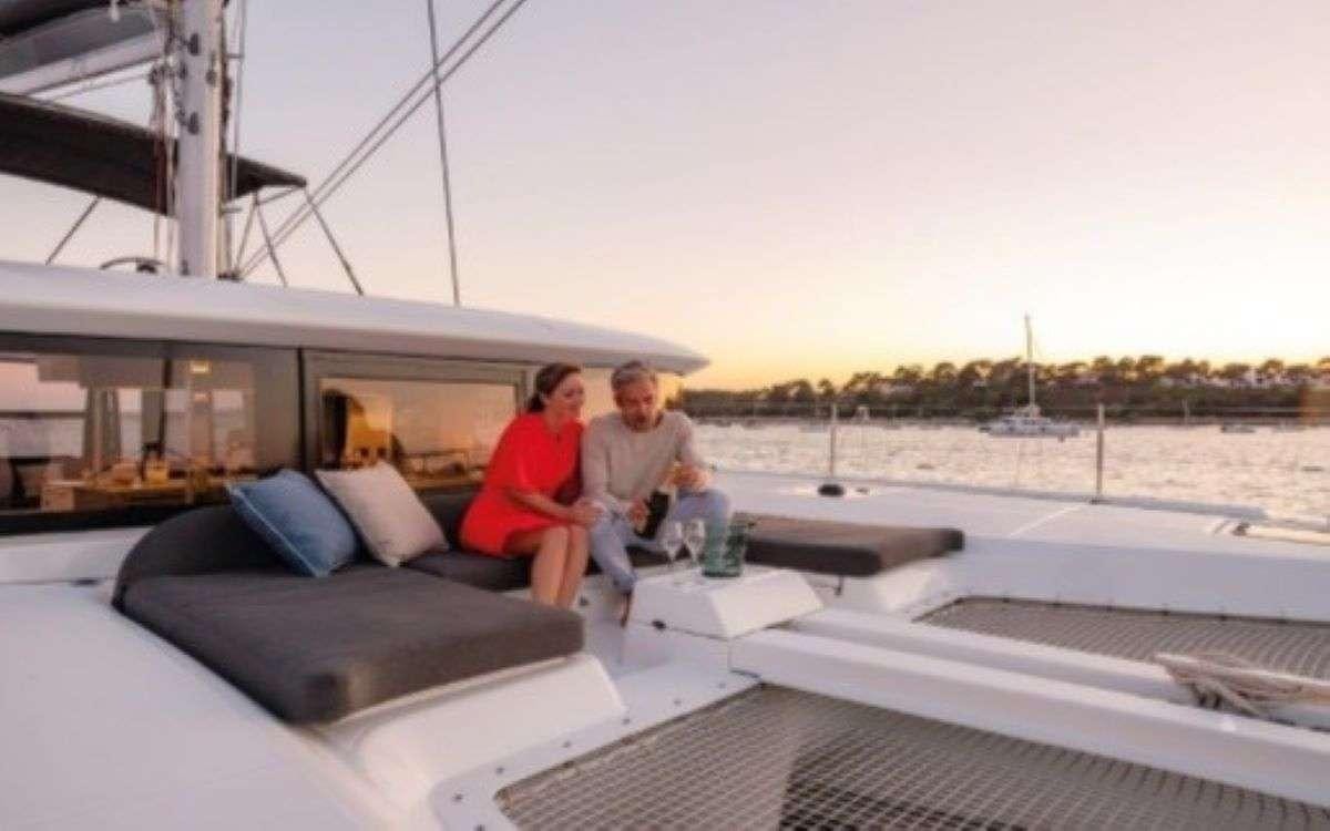a couple sitting on a boat aboard MARCH DRAGON Yacht for Charter