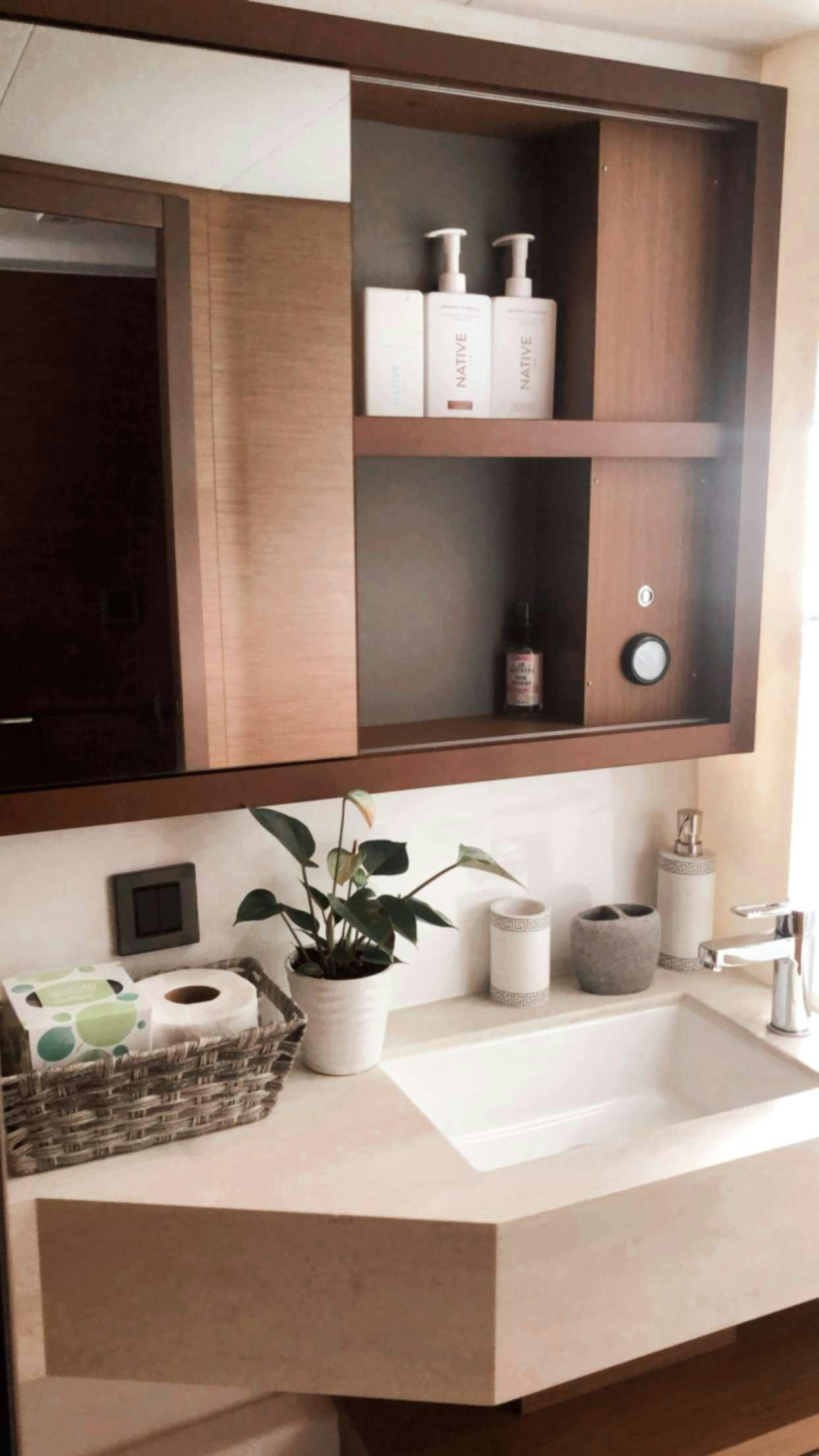a bathroom with a mirror and a sink aboard MARCH DRAGON Yacht for Charter