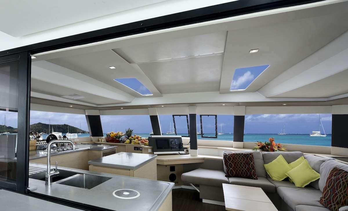 a modern living room with a large window aboard Cruising TW52 Yacht for Charter