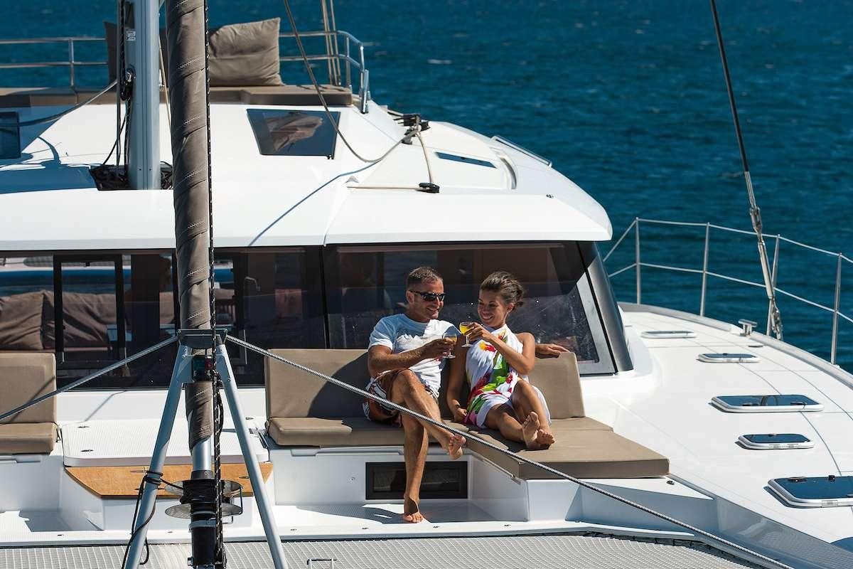 a man and a child on a boat aboard Cruising TW52 Yacht for Charter
