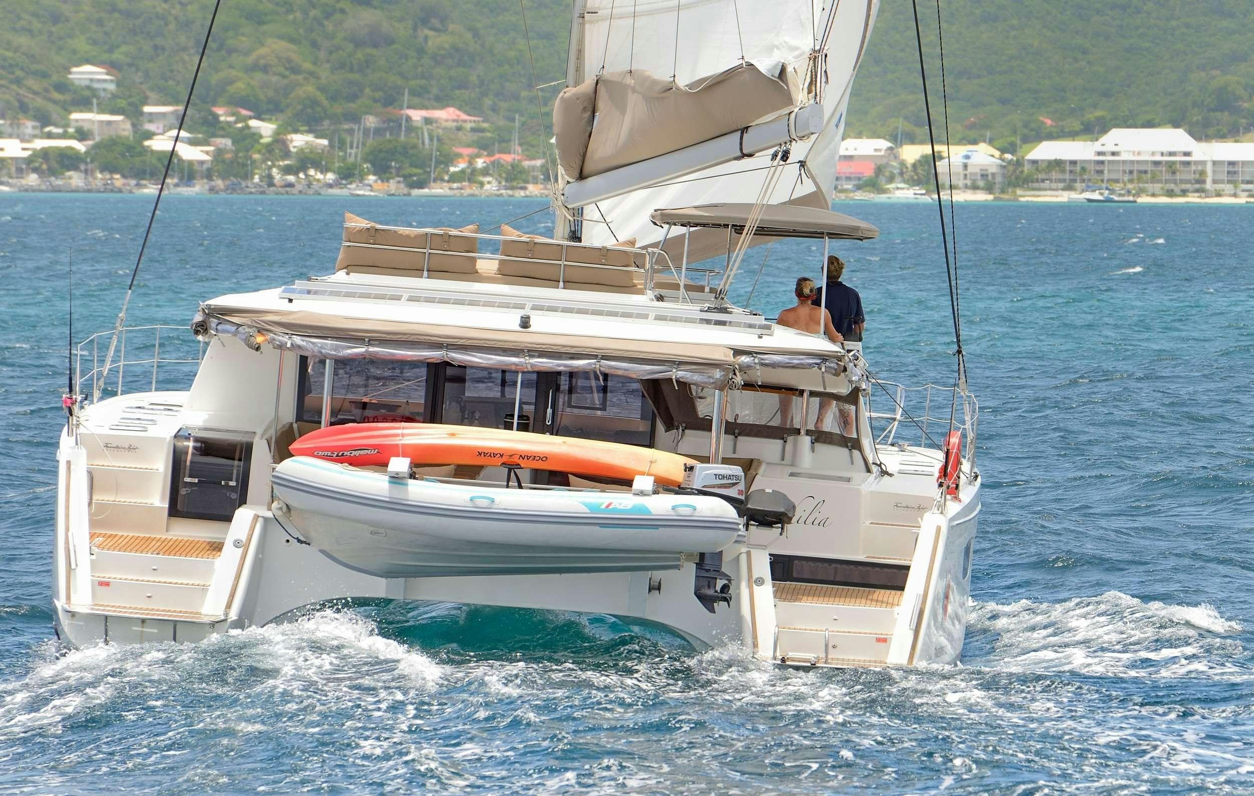 a couple of people on a boat aboard Cruising TW52 Yacht for Charter