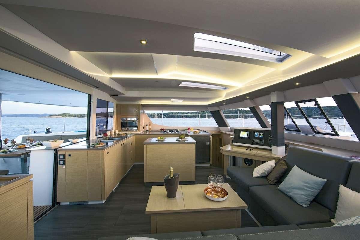 a modern looking kitchen and living room aboard Cruising TW52 Yacht for Charter