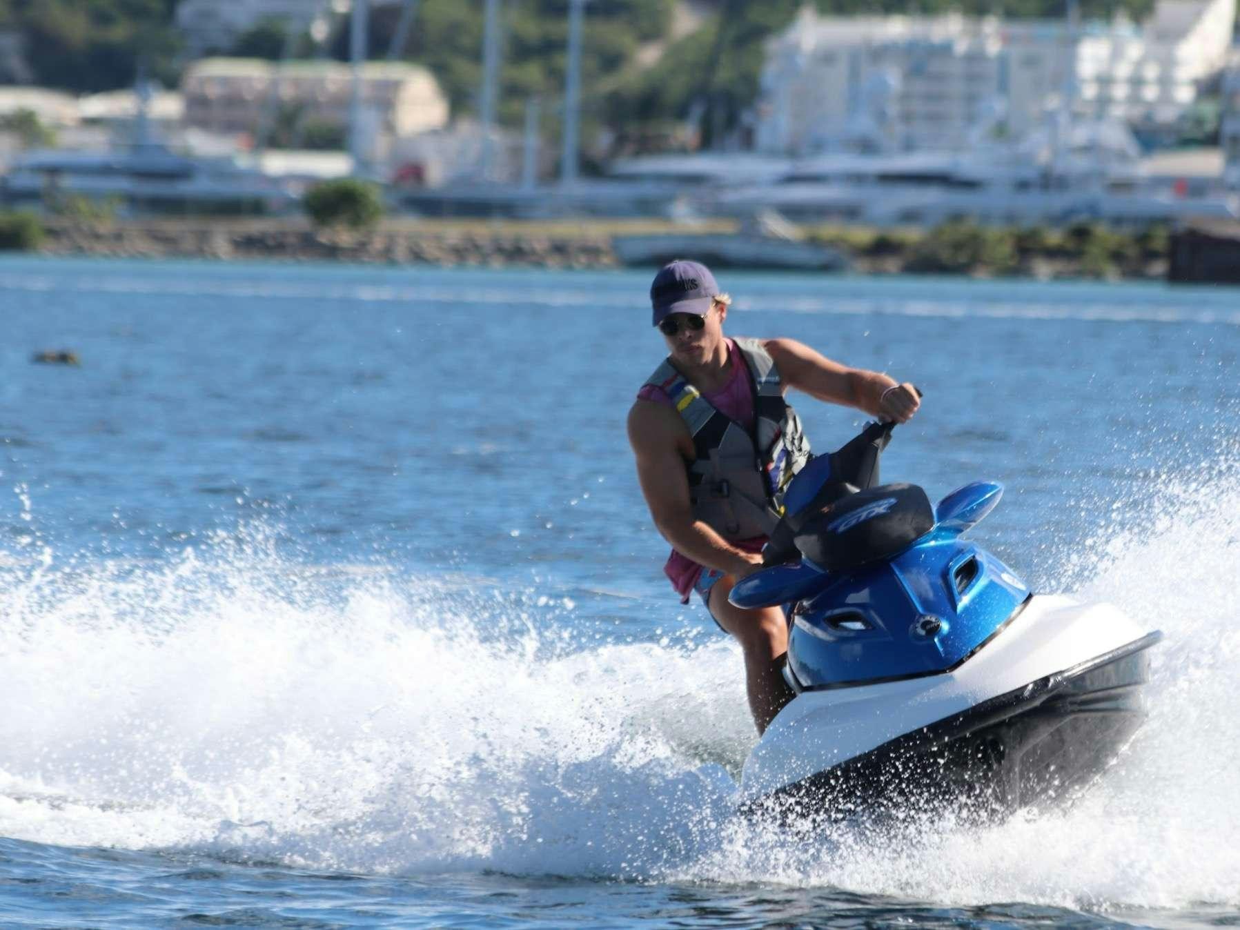 a man on a jet ski aboard ECLIPSE 114 Yacht for Charter