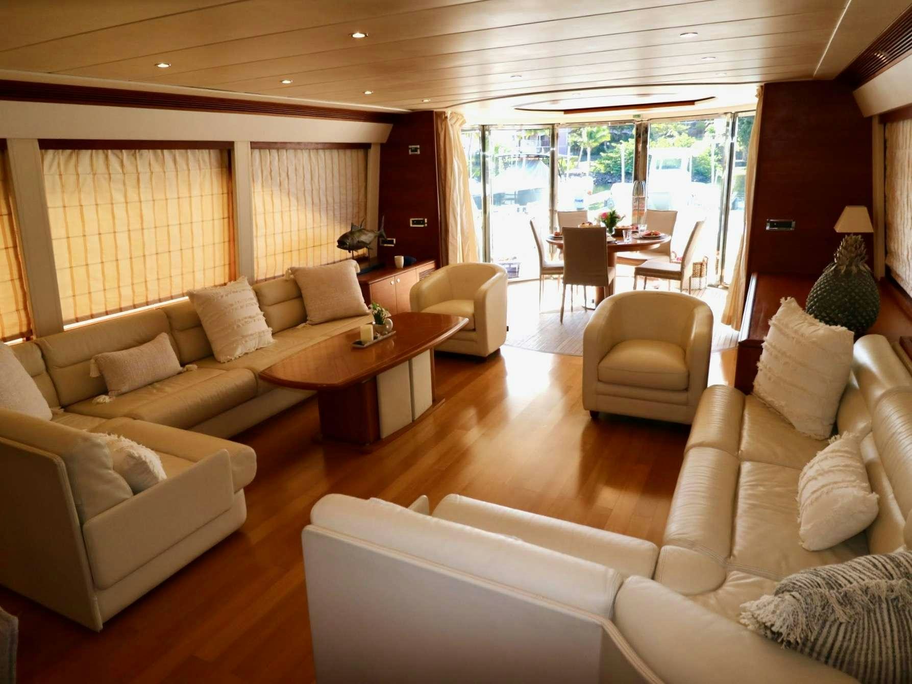 a living room with a couch and a table aboard ECLIPSE 114 Yacht for Charter