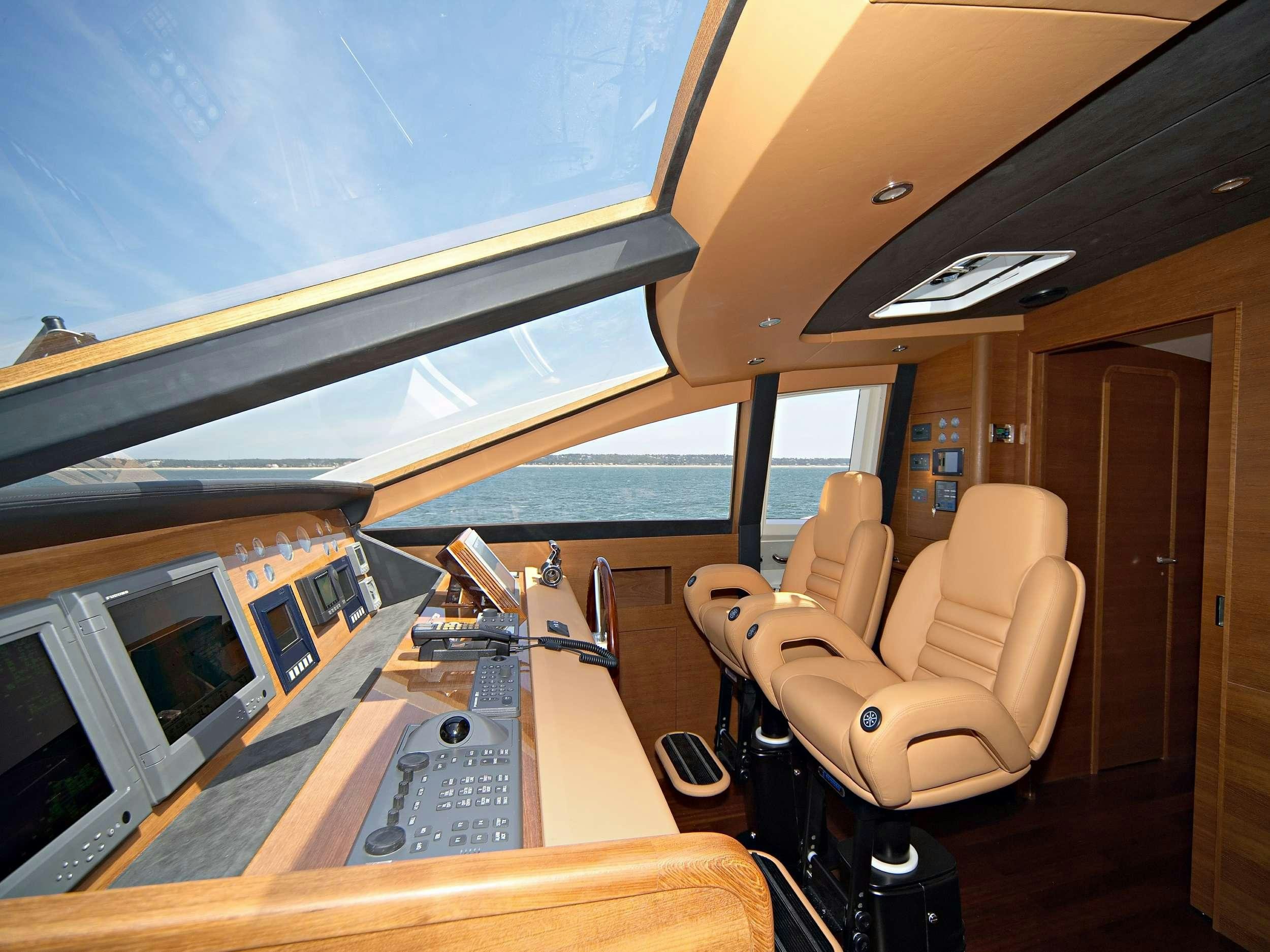 a room with a view of the water and the deck aboard ECLIPSE 114 Yacht for Charter