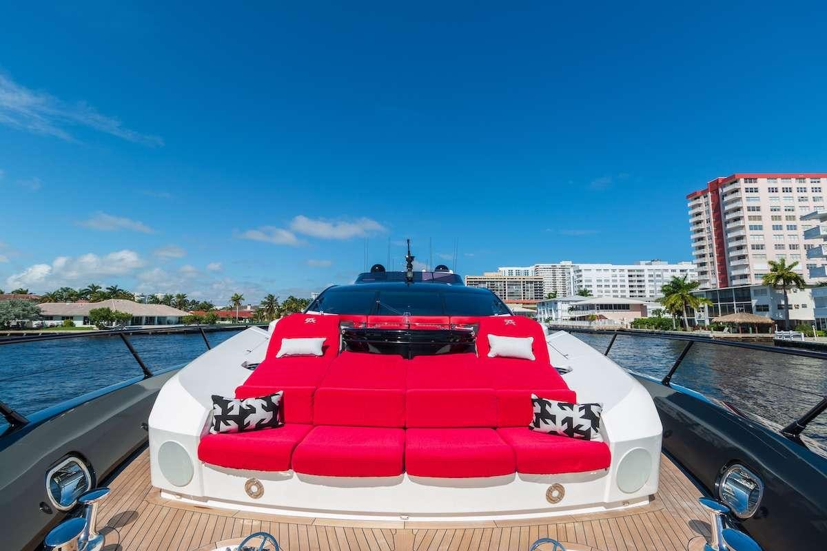 a red sports car parked on a bridge aboard CANELO Yacht for Charter