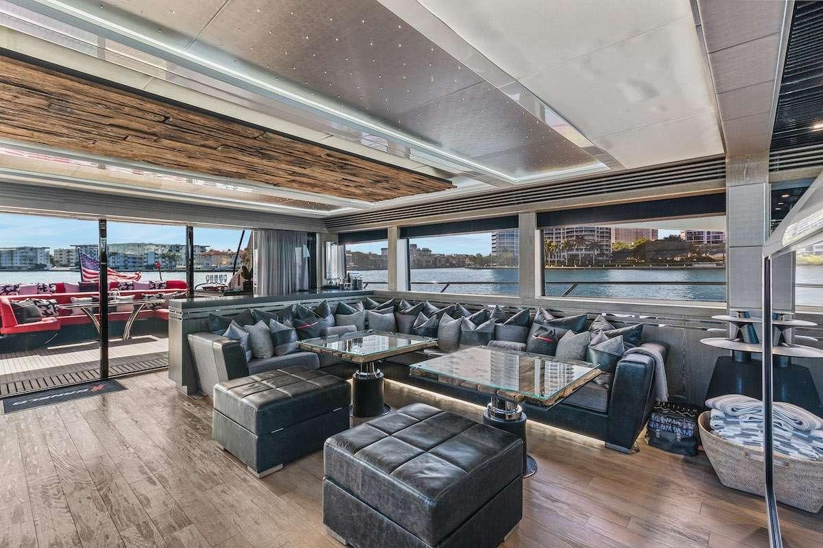 a living room with a couch and a table aboard CANELO Yacht for Charter