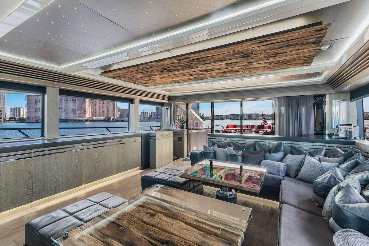 a large room with a couch and a table aboard CANELO Yacht for Charter