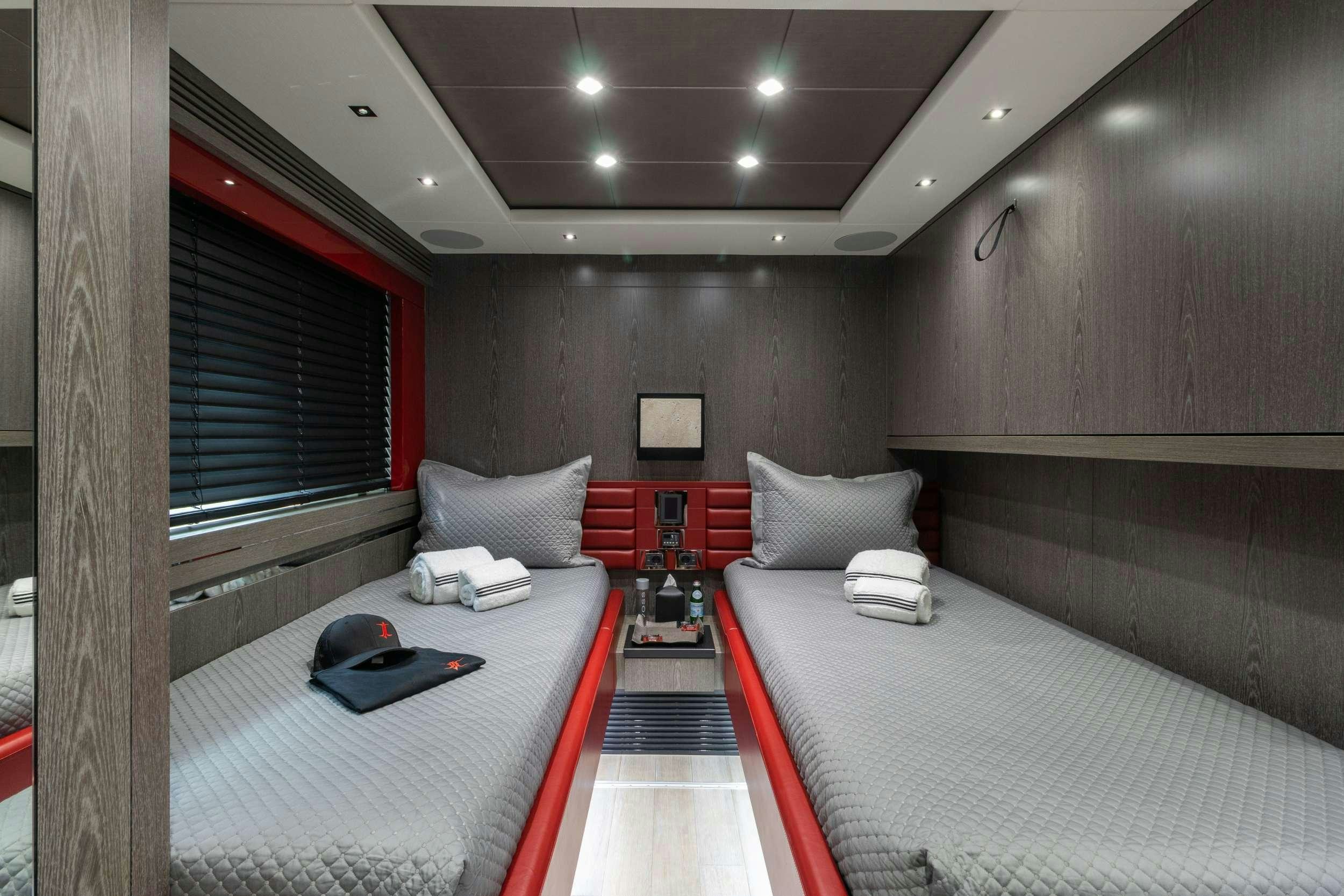 a room with a bed and a desk aboard CANELO Yacht for Charter