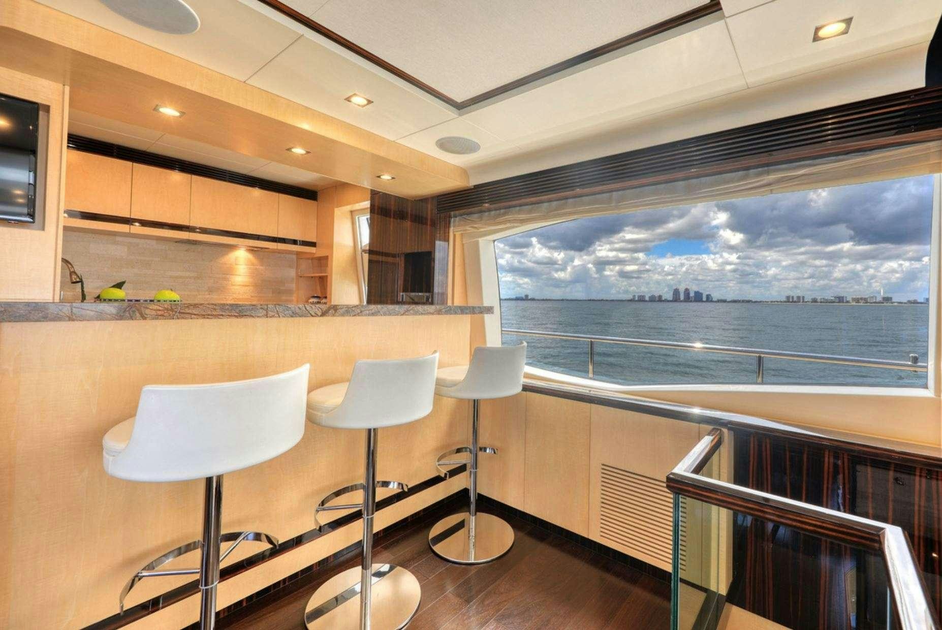 a room with chairs and a table aboard VALERE Yacht for Charter
