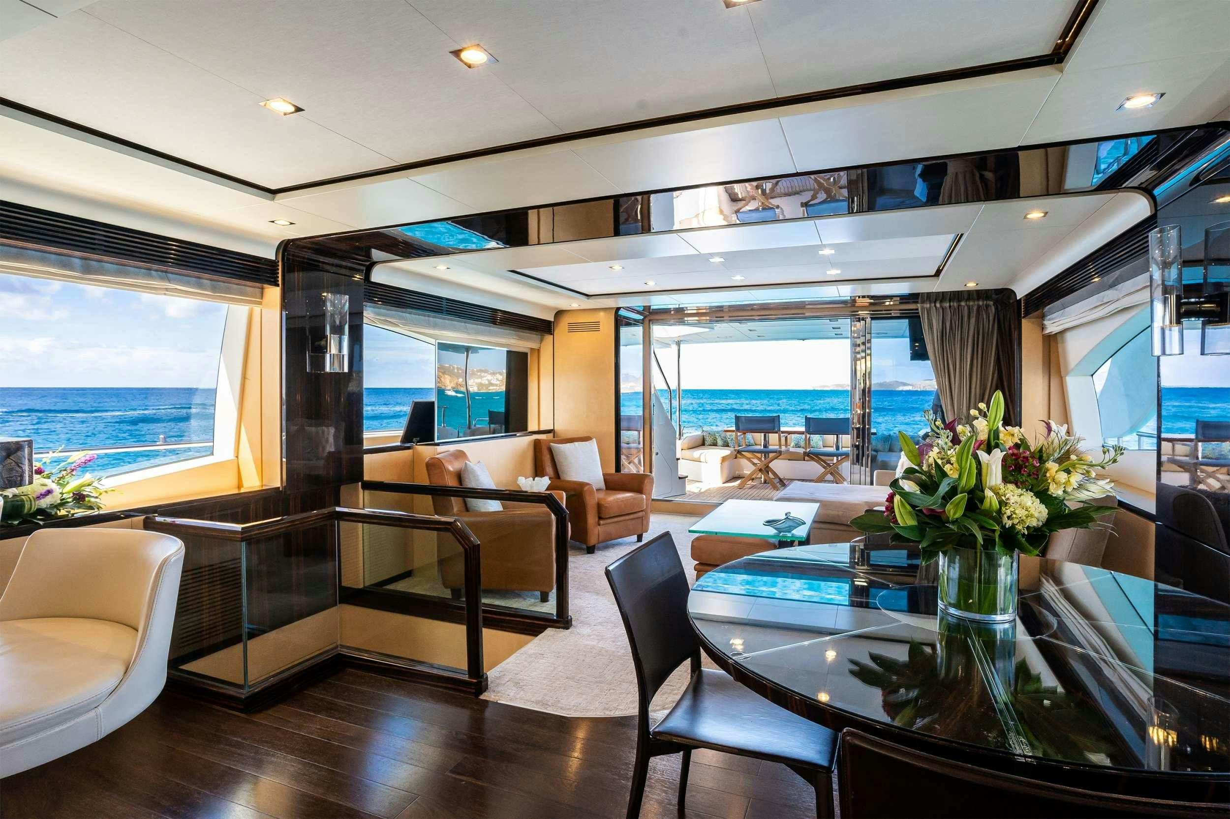 a living room with a table and chairs aboard VALERE Yacht for Charter