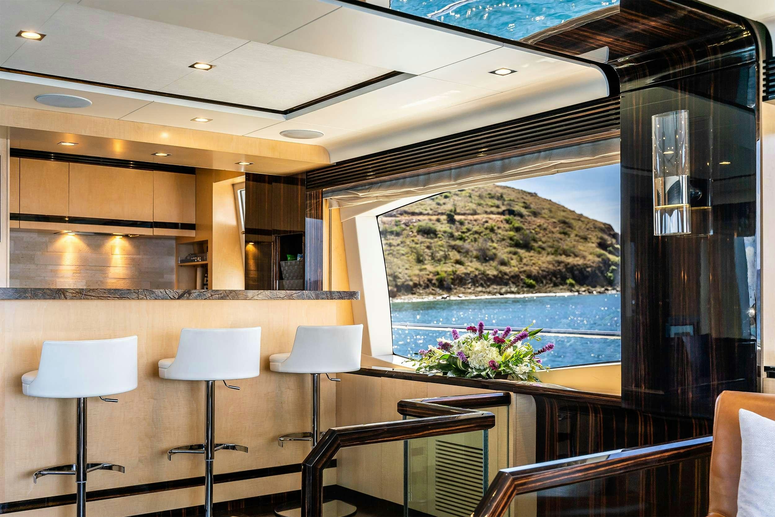 a room with tables and chairs aboard VALERE Yacht for Charter