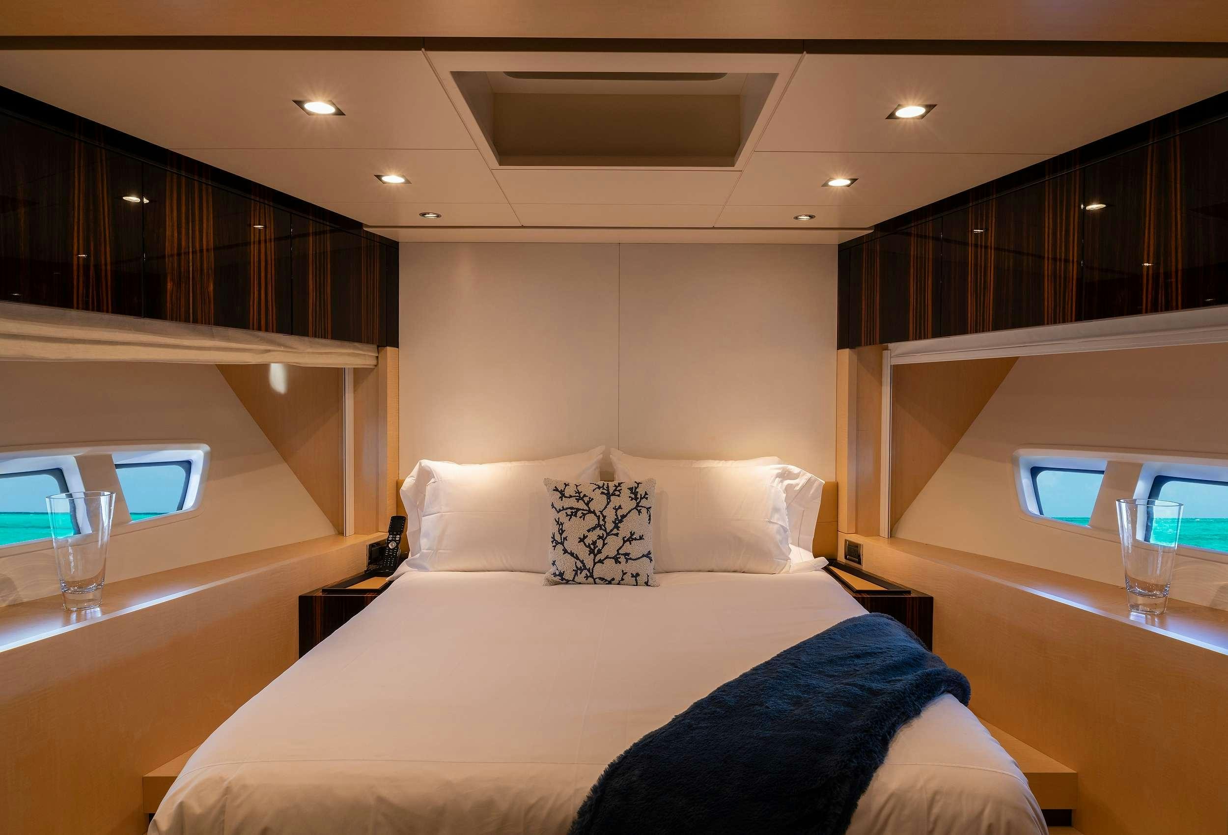 a bed with pillows aboard VALERE Yacht for Charter