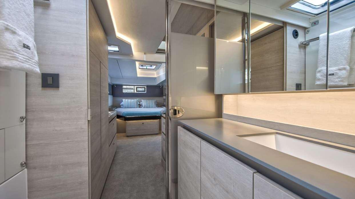 a hallway with a few doors aboard Atumavu Yacht for Charter