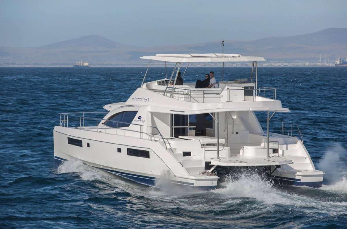 a white yacht on the water aboard JamSam Yacht for Charter