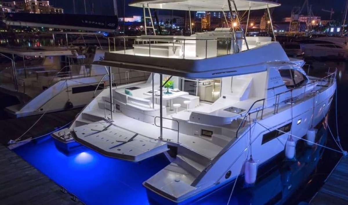 a group of boats in a harbor aboard JamSam Yacht for Charter