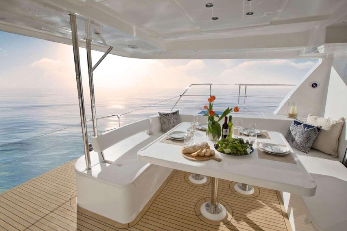 a table with food on it aboard JamSam Yacht for Charter