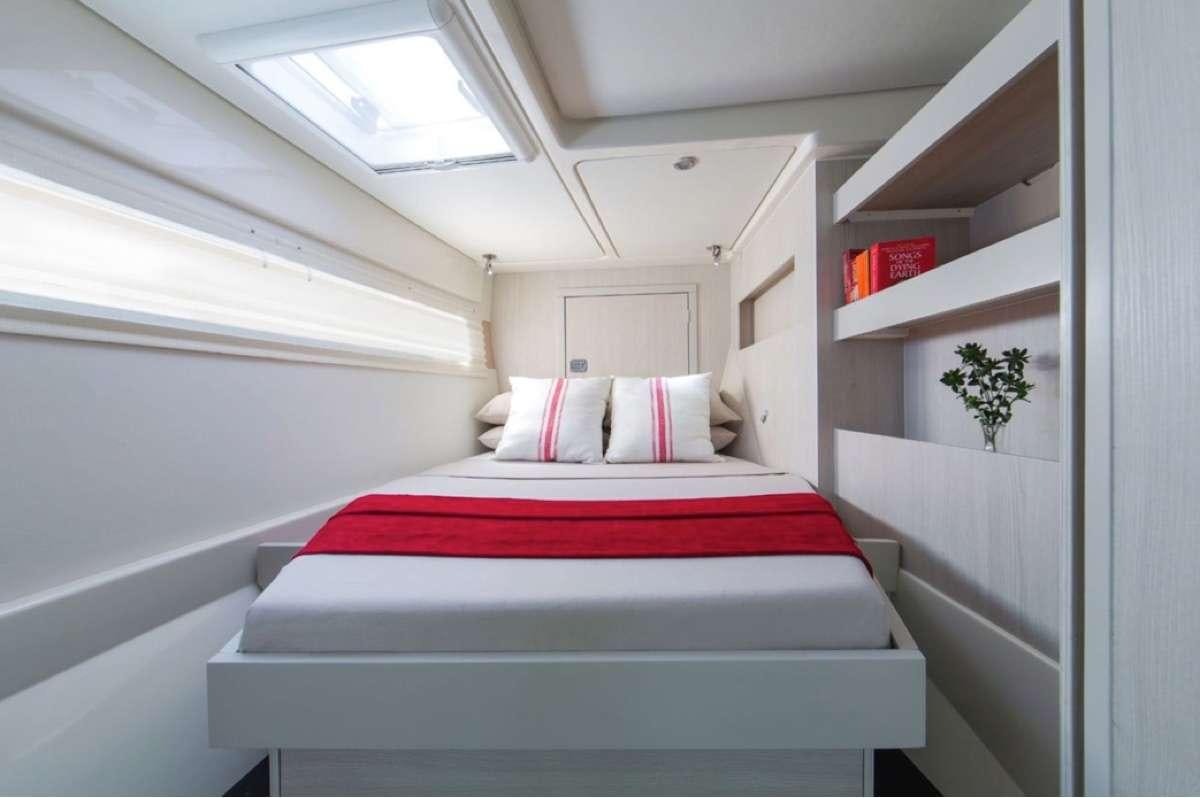 a bed in a room aboard JamSam Yacht for Charter