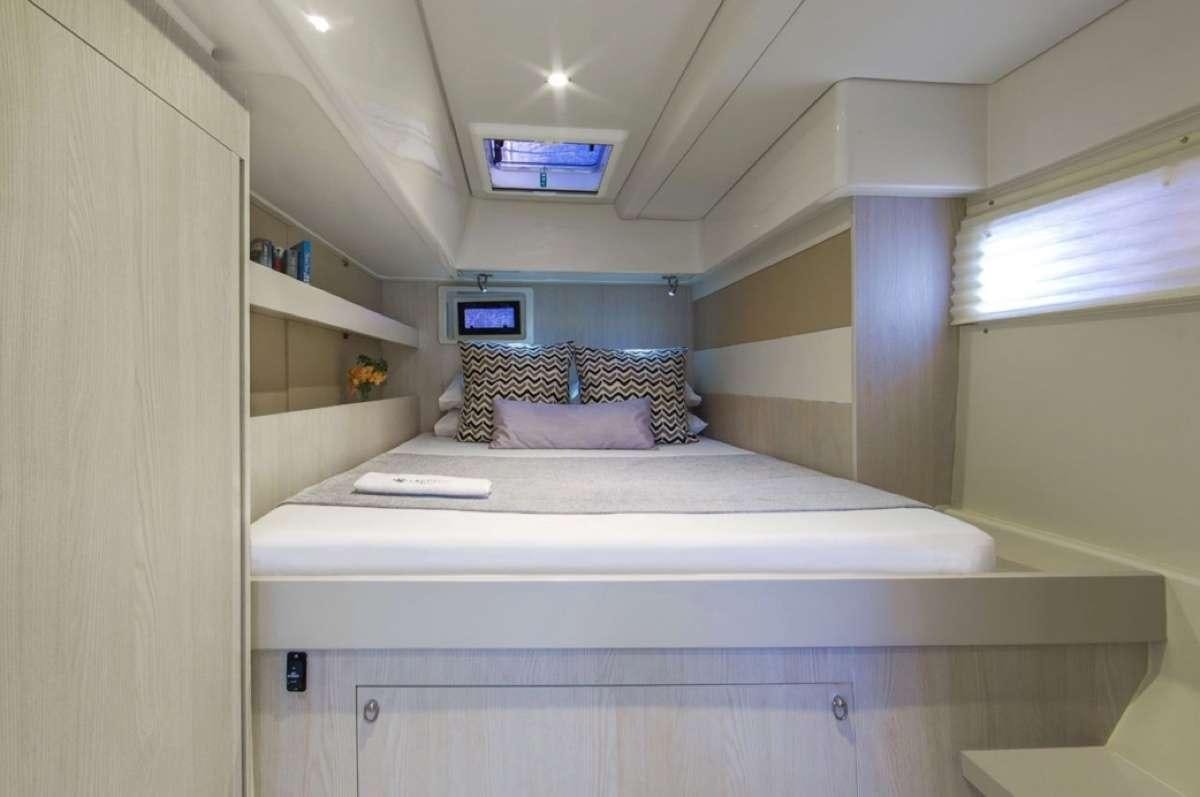 a bed in a room aboard JamSam Yacht for Charter