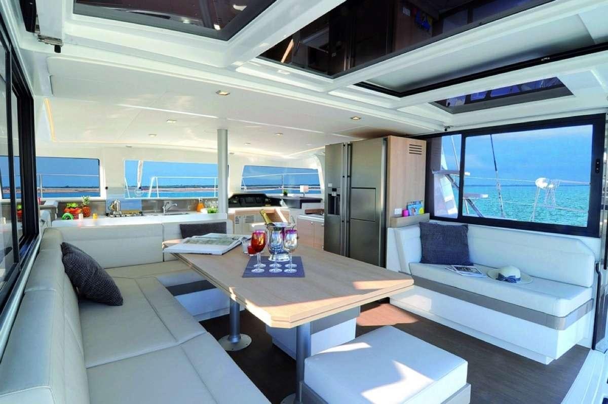 a room with a desk and a bed aboard Barbara Jane Yacht for Charter