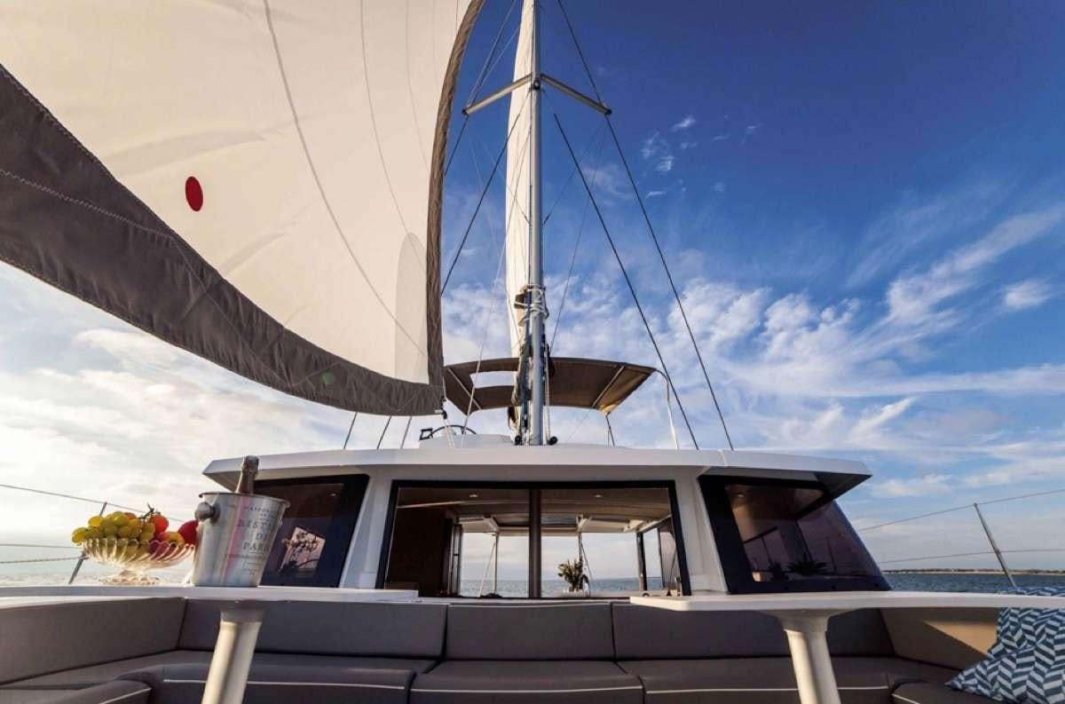 a boat with a large sail aboard Barbara Jane Yacht for Charter