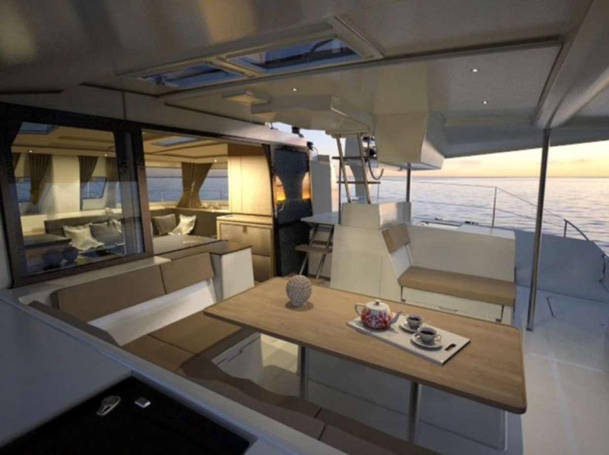 a room with a table and chairs aboard Heliades Yacht for Charter